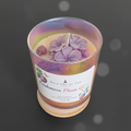 Cashmere Plum Glow Soy Candle with purple flower wax toppers in iridescent rainbow jar